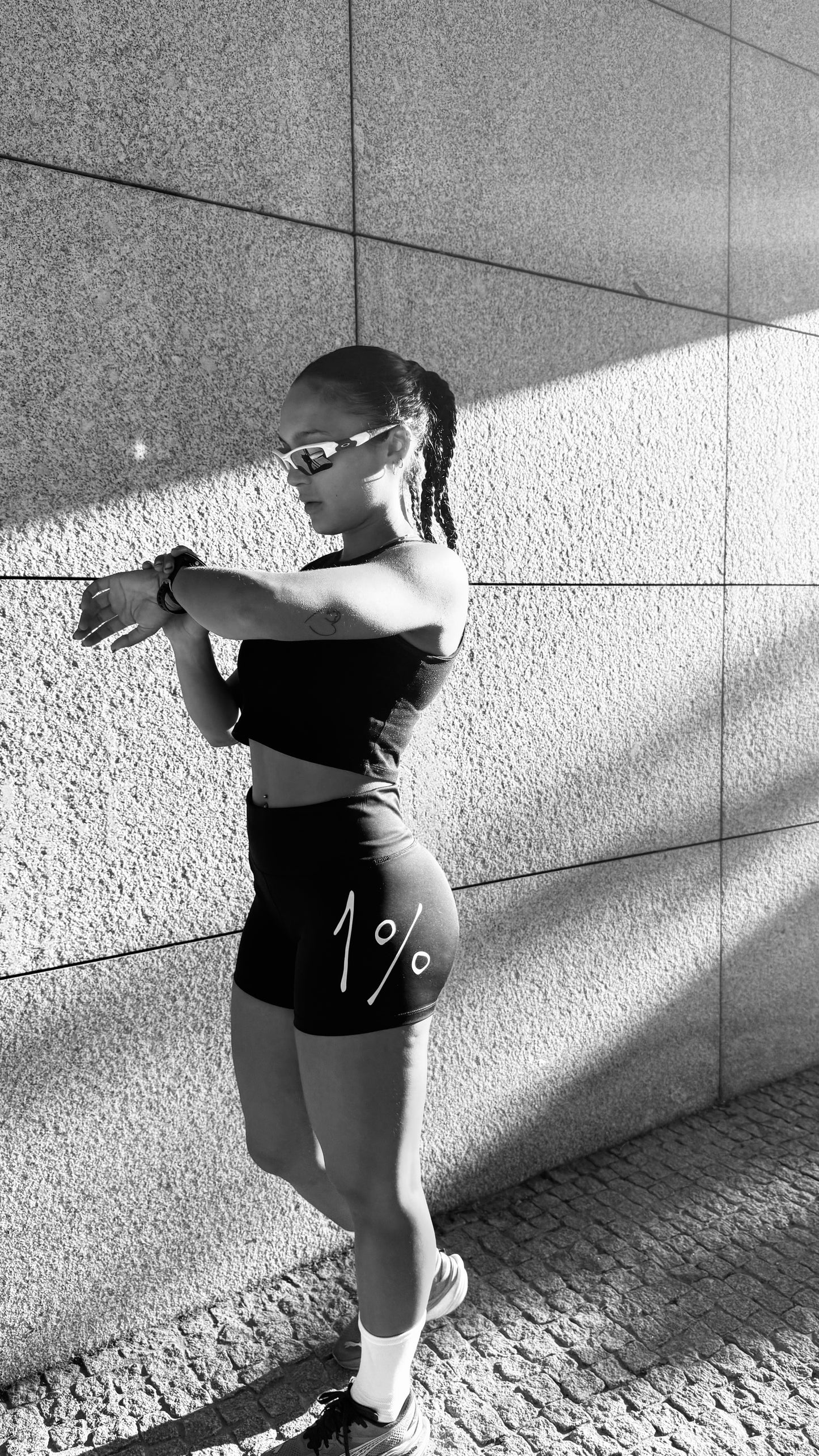 Full-body side view stretching in Women’s Training Shorts — outdoor training