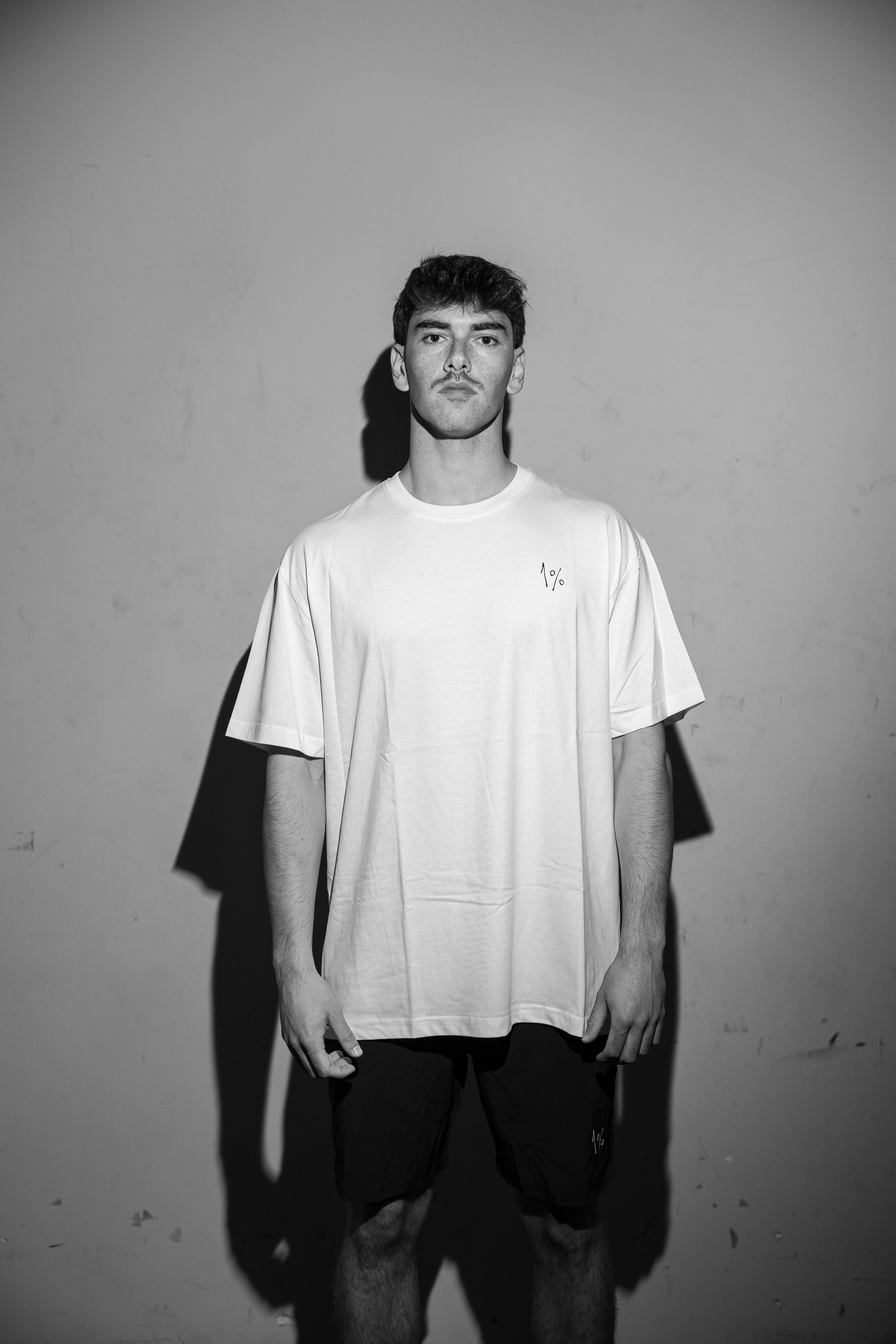 Model wearing oversized white T-shirt — front view, relaxed fit