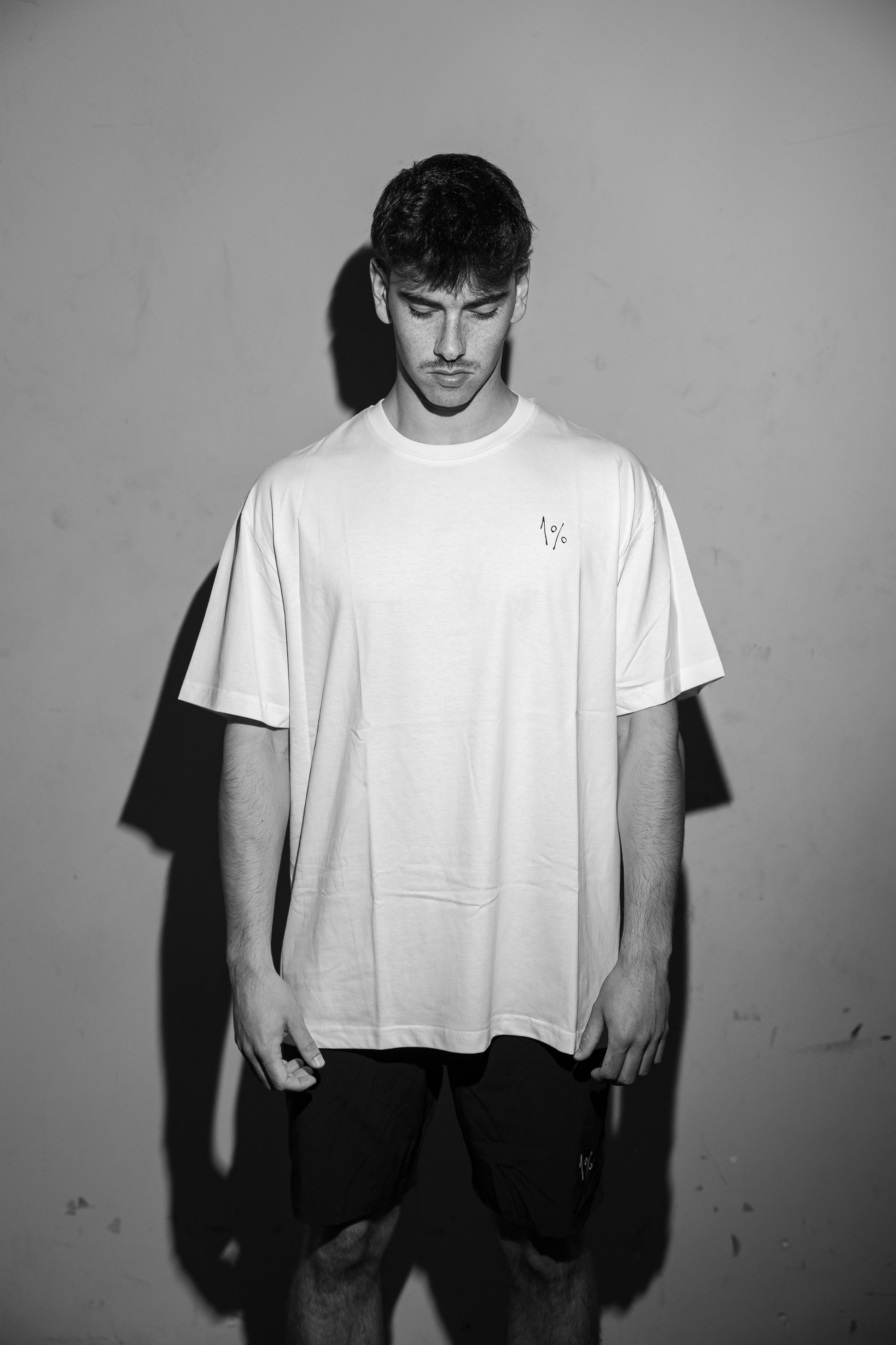 Model stretching in oversized tee — everyday movement